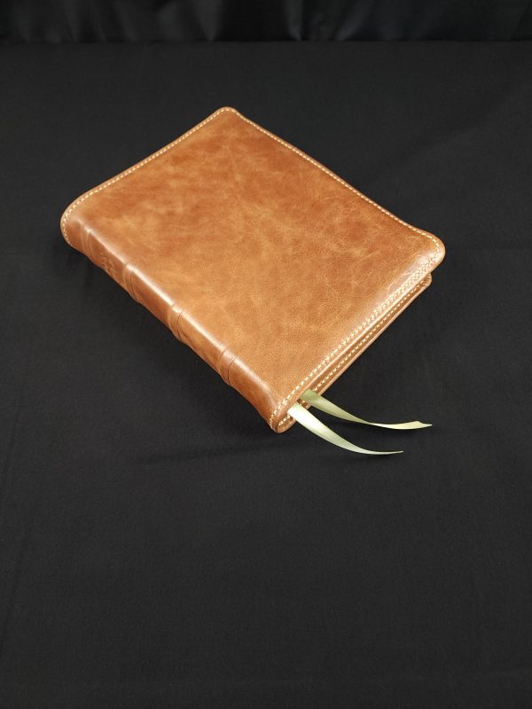 Brown sheepskin Cover with 2 sage green ribbons