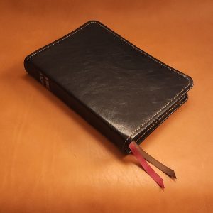 Black sheepskin leather LSB Wide Margin Bible with honey brown perimeter stitching and two ribbons