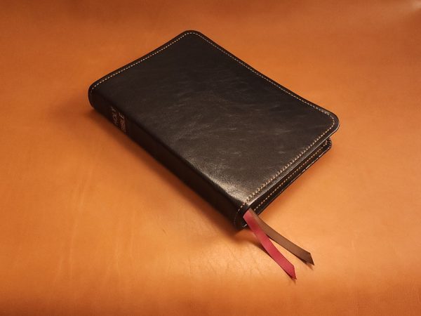 Black sheepskin leather LSB Wide Margin Bible with honey brown perimeter stitching and two ribbons