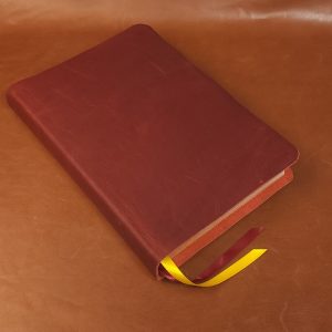 Red cowhide Interleaved Bible, Journaling Edition with two ribbons in a rugged leather style