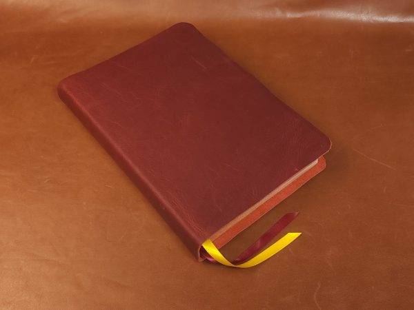 Red cowhide ESV Study Bible with two ribbons in a rugged leather style
