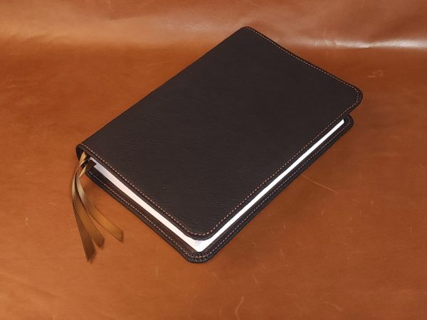 Black cowhide leather Every Man's Bible with brown perimeter stitch and three chocolate brown ribbons