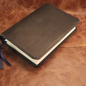 Journal The Word Bible in black cowhide leather with navy blue perimeter stitch and two ribbons