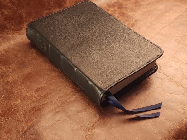 Black cowhide leather ESV Journaling Study Bible with navy blue perimeter stitch and two ribbons
