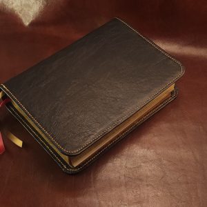 Black sheepskin leather LSB Wide Margin Bible with honey brown perimeter stitching and two ribbons