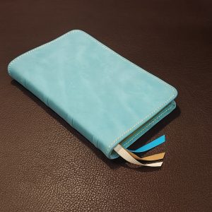 Turquoise blue cowhide Thinline Bible with camel tan sheepskin liner and three ribbons