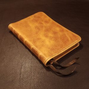 Distressed natural tan cowhide Thinline Bible with walnut brown distressed cowhide liner and two ribbons