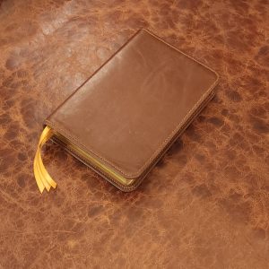 Antiqued brown sheepskin Thinline Bible with camel tan sheepskin liner and three ribbons