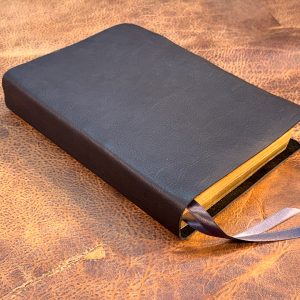 Black cowhide Every Man's Bible with two ribbons in a rugged leather style