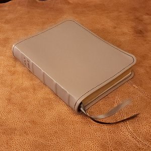 Smooth gray sheepskin leather Thinline Bible with black sheepskin liner, black perimeter stitching and two ribbons