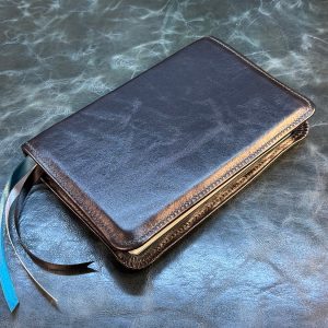 Antiqued black sheepskin Thinline Bible with aqua blue distressed cowhide liner and three ribbons