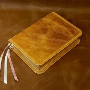 Personal Size Large Print Bible in natural tan distressed cowhide leather with light pink calfskin liner and three ribbons