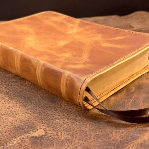 Life Application Study Bible in distressed natural tan cowhide leather with walnut brown distressed cowhide liner and two ribbons