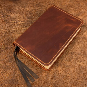 ESV Study Bible in distressed cognac cowhide leather with natural tan distressed cowhide liner and three ribbons