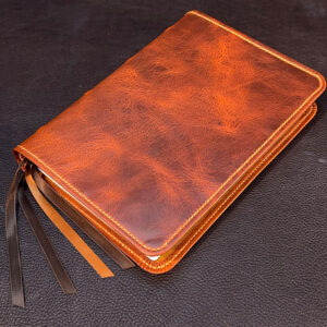 ESV Study Bible in distressed cognac cowhide leather with tan pullup cowhide liner and four ribbons